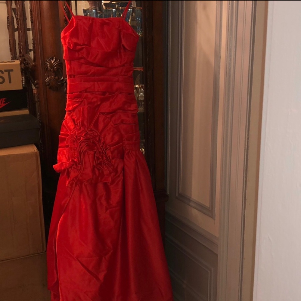 Red gown with long sleeve jacket